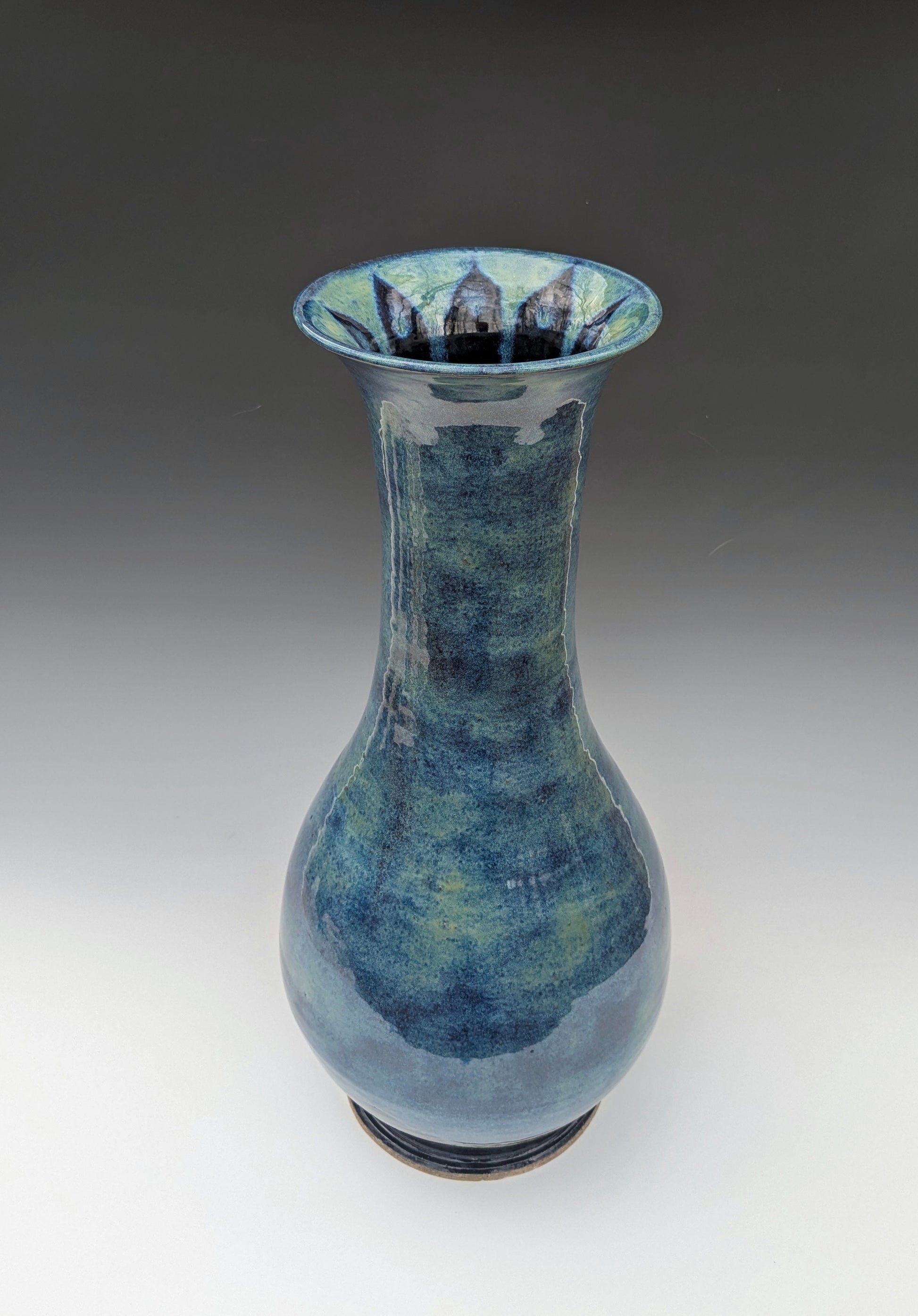 Blue ceramic vase on a white background
